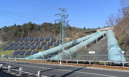 An energy facility in Germany, where energy from solar cells pumps water up to a reservoir during the day.  During the night it flows down again through turbines, to generate electricity.